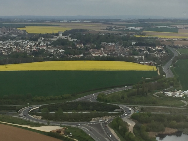 From the plane, these golden fields could be seen in every direction. In the foreground is one of their beloved roundabouts.