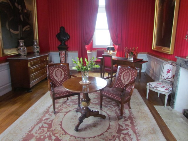 This beautiful red-wallpapered room was the Orleans-Penthievre Study.