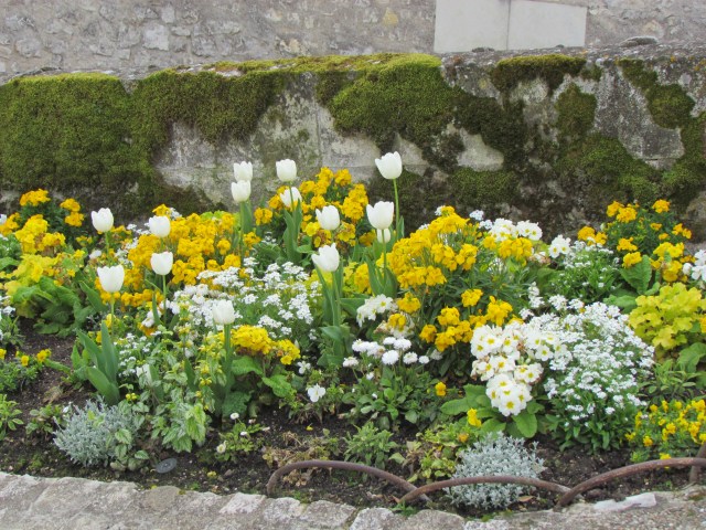 Small spring flower gardens on the castle grounds are very artistically designed.