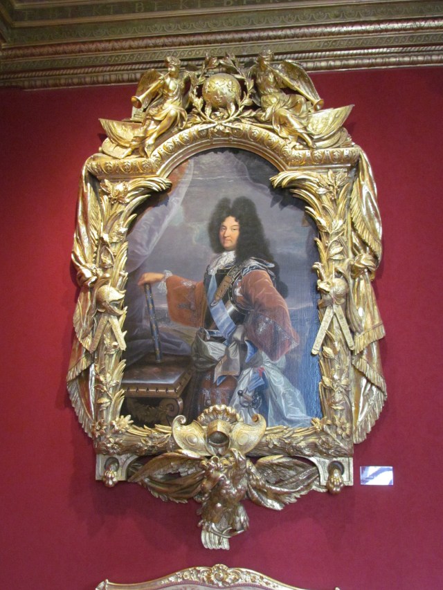 This portrait of Louis XIV was painted by Rigaud and was very striking. But the thing that was most impressive was the magnificently carved and gilded frame that it was in, which was done by Lepautre.