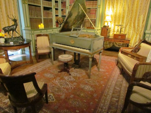 This was the music room. Notice the artist's painting on the inside of the piano lid.