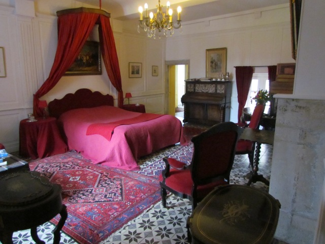 We have a small suite and it's fabulous! It is filled with antiques and even has an antique piano. There's a fireplace and antique tiles on the floor. There's even a book that talks about the Ravalet Chateau that we're going to see tomorrow.