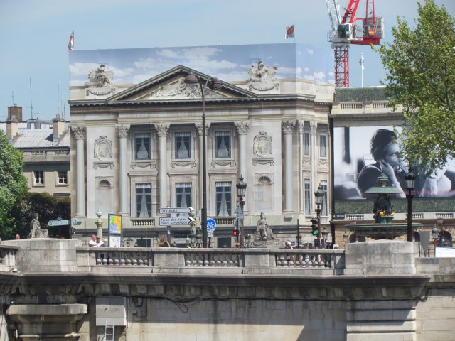 Phony! This is another one of those buildings that is undergoing renovations so they're mounted a painted tarp on the front. So much better than looking at scaffolding.!